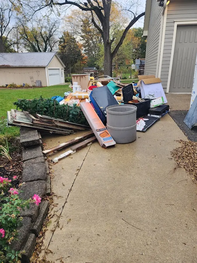 Dumpster being loaded with debris for Commercial Dumpster Rental in Lakewood Park